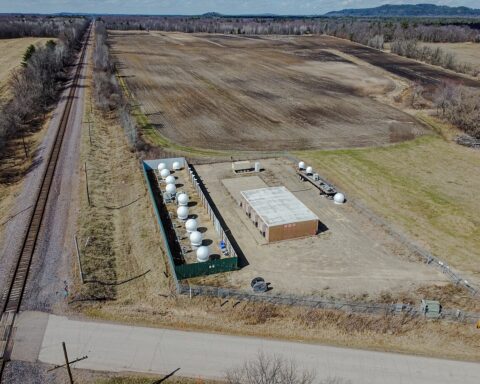 Aerial view of a Starlink ground station in Merrillan, Wisconsin, with satellite antennas inside a fenced compound. Illustrative photograph, not the Polish site.